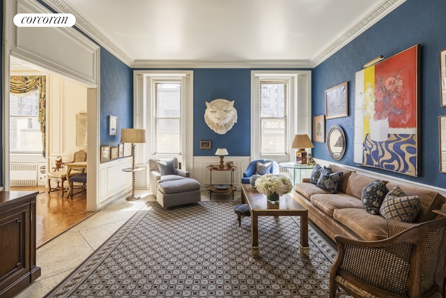 32 E 64th St Unit 5E, New York City, NY 10021 - living room featuring wainscoting, plenty of natural light, crown molding, wallpapered walls, and radiator