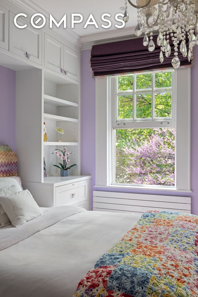 bedroom with crown molding