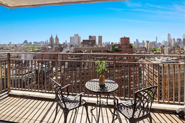 balcony featuring a skyline view