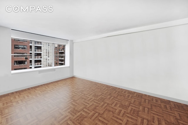 empty room with baseboards