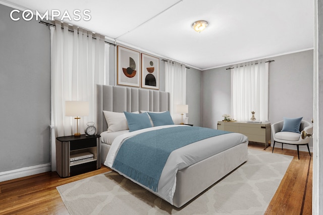 43-08 41st St Unit 5D, New York City, NY 11104 - bedroom featuring wood finished floors and baseboards