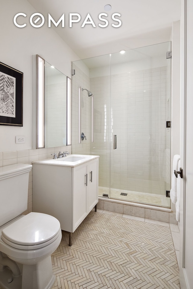 100 Barclay St Unit 20D, New York City, NY 10007 - bathroom featuring vanity, toilet, a shower stall, tile walls, and recessed lighting