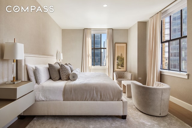 100 Barclay St Unit 20D, New York City, NY 10007 - bedroom with multiple windows, wood finished floors, and baseboards