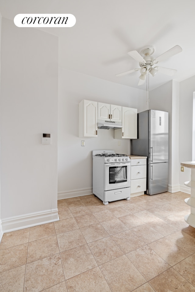 728 41st St Unit 3C, New York City, NY 11232 - kitchen with white range with gas cooktop, freestanding refrigerator, under cabinet range hood, and baseboards