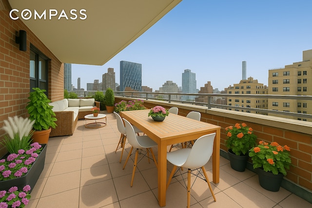 balcony with a skyline view and an outdoor living space