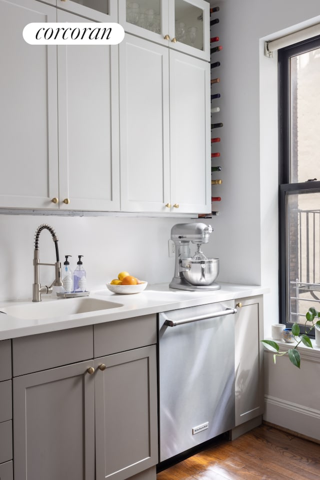 157 Kane St Unit 3, New York City, NY 11231 - bar with stainless steel dishwasher, a sink, plenty of natural light, and wood finished floors
