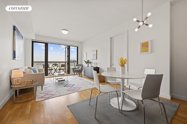 500 4th Ave Unit 10I, New York City, NY 11215 - dining area with wood finished floors, baseboards, and a chandelier