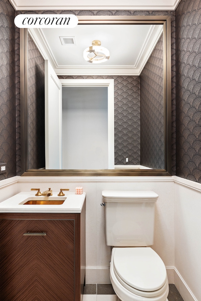 100 Barclay St Unit 20B, New York City, NY 10007 - half bathroom featuring wallpapered walls, vanity, crown molding, toilet, and baseboards