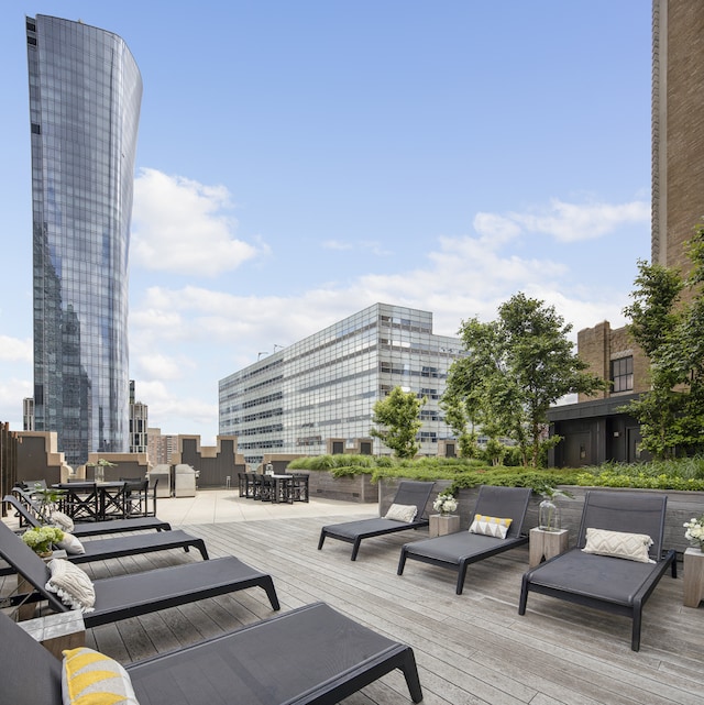 100 Barclay St Unit 20B, New York City, NY 10007 - wooden terrace with outdoor dining area and a view of city