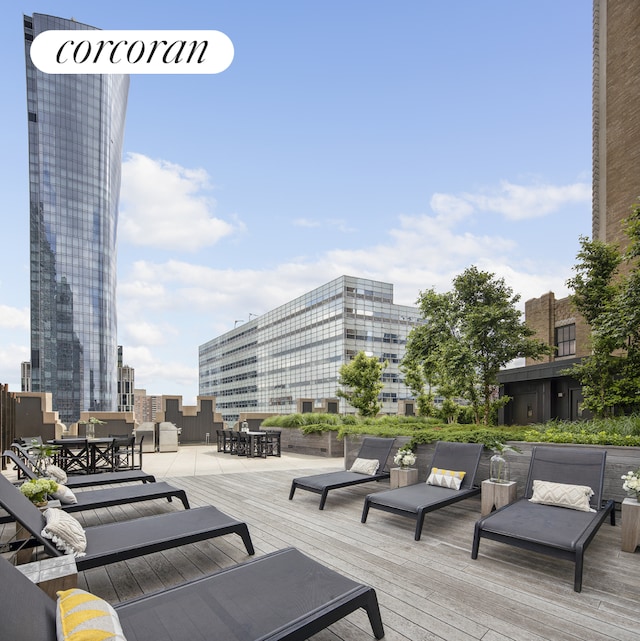 100 Barclay St Unit 20B, New York City, NY 10007 - wooden deck featuring a city view and outdoor dining area