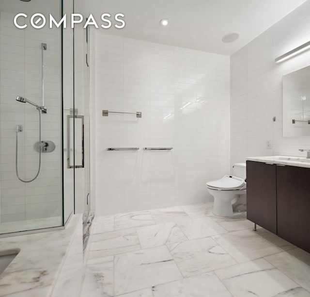 101 Warren St Unit 11L, New York City, NY 10007 - bathroom featuring vanity, a stall shower, tile walls, and marble look tile flooring