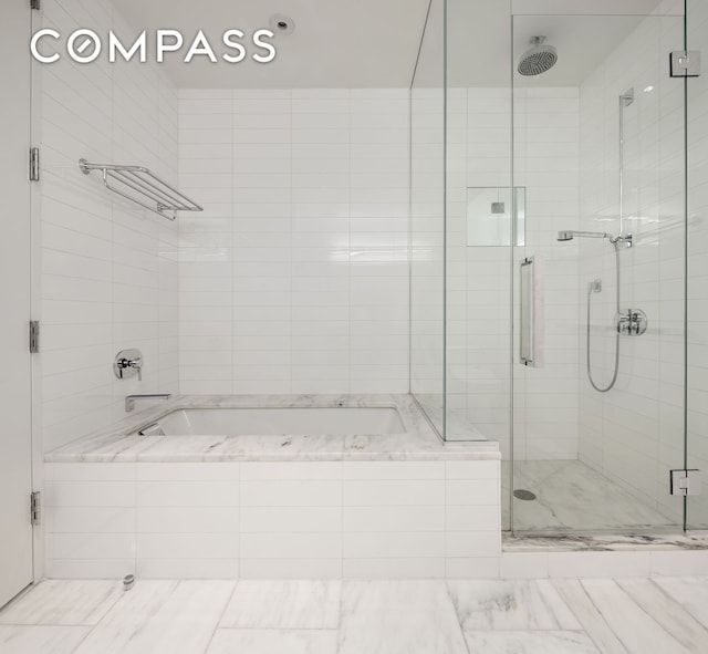 101 Warren St Unit 11L, New York City, NY 10007 - bathroom featuring a stall shower and a garden tub