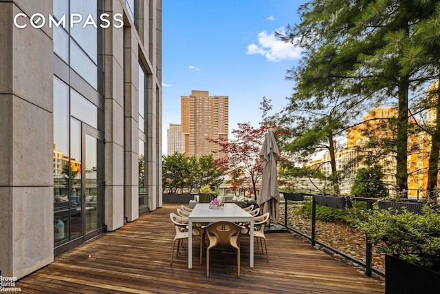 101 Warren St Unit 11L, New York City, NY 10007 - wooden deck with a city view and outdoor dining area