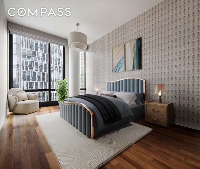 101 Warren St Unit 11L, New York City, NY 10007 - bedroom featuring wallpapered walls and hardwood / wood-style floors