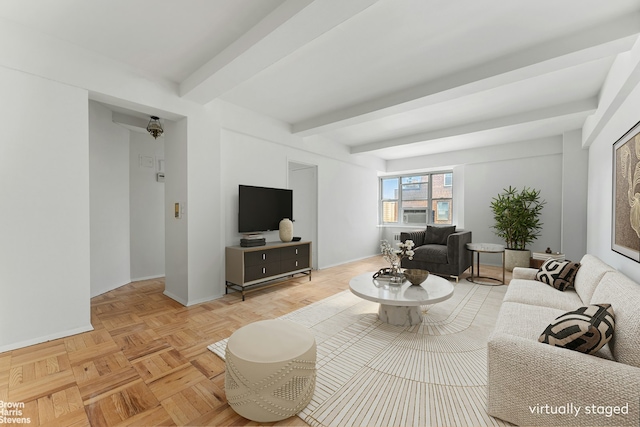 living area featuring beam ceiling, baseboards, and cooling unit