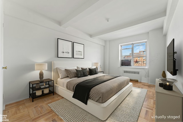 bedroom with radiator, beamed ceiling, and baseboards