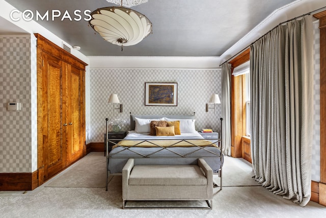 623 2nd St, New York City, NY 11215 - bedroom with light colored carpet, wallpapered walls, and baseboards