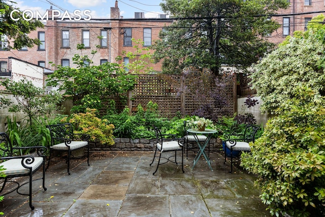 view of patio / terrace featuring fence