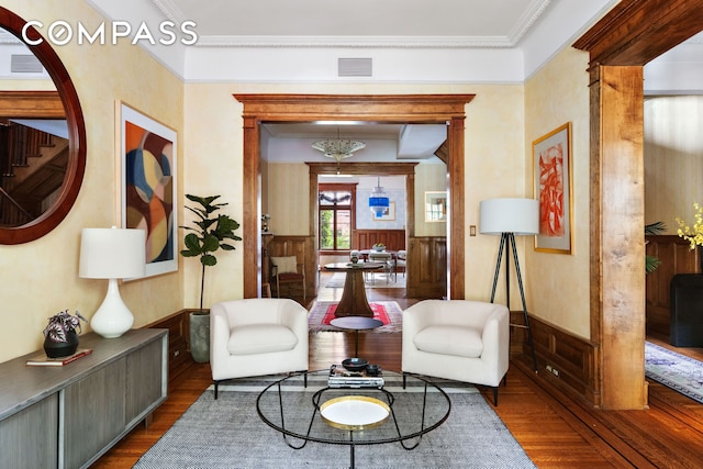 623 2nd St, New York City, NY 11215 - sitting room with wood finished floors, ornamental molding, and a wainscoted wall
