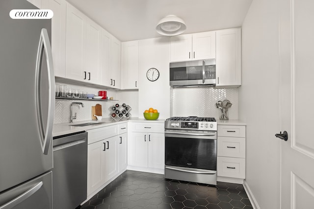 145 Park Pl Unit 5E, New York City, NY 11217 - kitchen featuring stainless steel appliances, a sink, light countertops, and backsplash