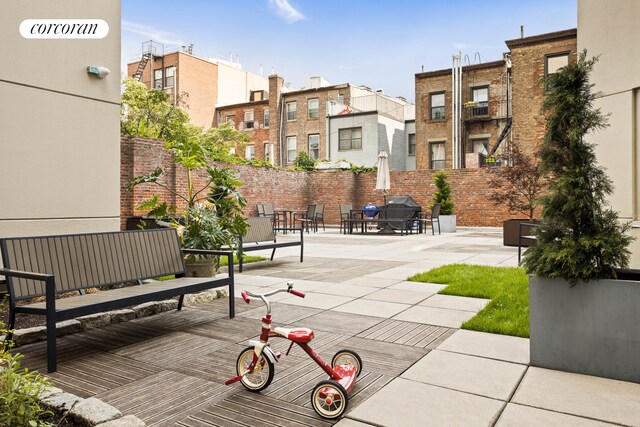 145 Park Pl Unit 5E, New York City, NY 11217 - view of community featuring a patio and a residential view