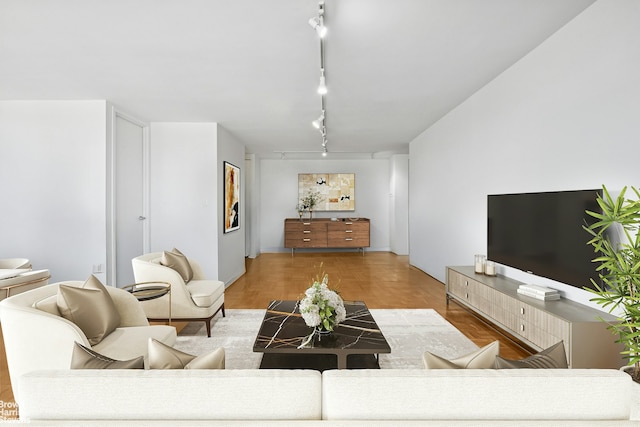 living area featuring track lighting