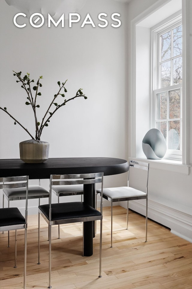 dining space featuring light wood-type flooring