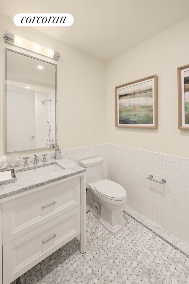 100 Claremont Ave Unit 31A, New York City, NY 10027 - bathroom with a wainscoted wall, vanity, and tile walls