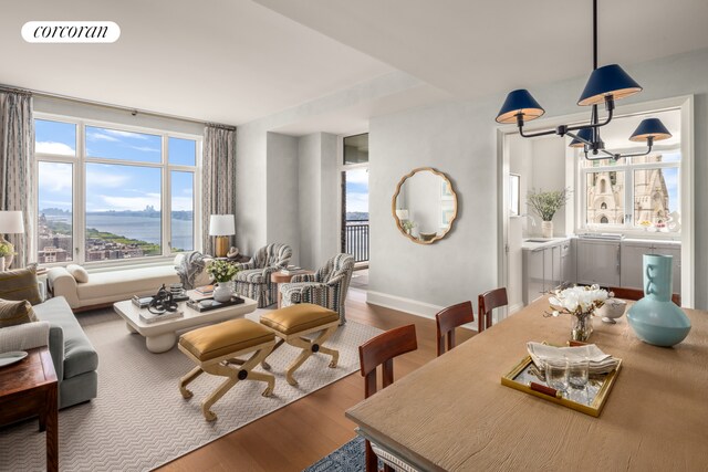 100 Claremont Ave Unit 31A, New York City, NY 10027 - dining space featuring wood finished floors, a chandelier, and a water view