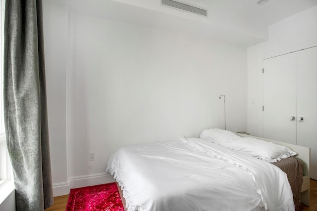 686 Mac Donough St Unit 3A, New York City, NY 11233 - bedroom featuring wood finished floors, baseboards, and a closet