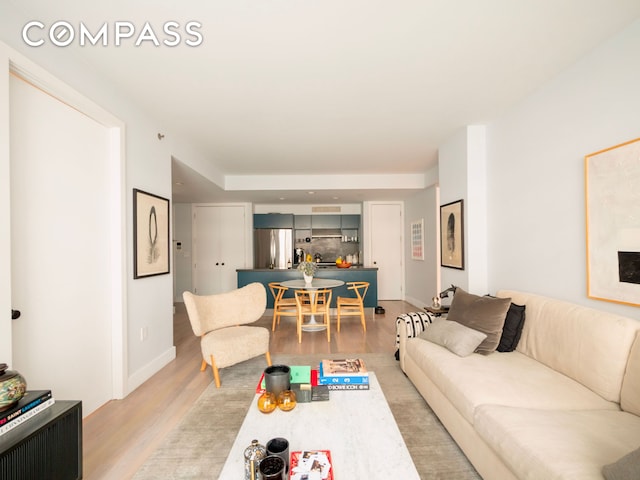 84 Front St Unit 5E, New York City, NY 11201 - living room with light wood finished floors and baseboards