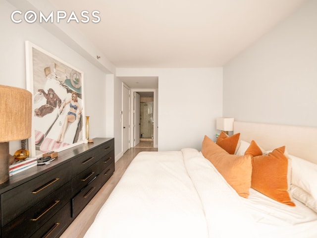 84 Front St Unit 5E, New York City, NY 11201 - bedroom featuring light wood-type flooring and baseboards