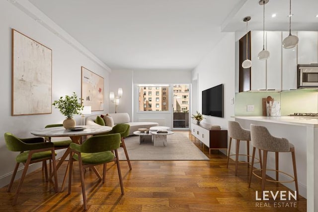 dining space featuring wood finished floors