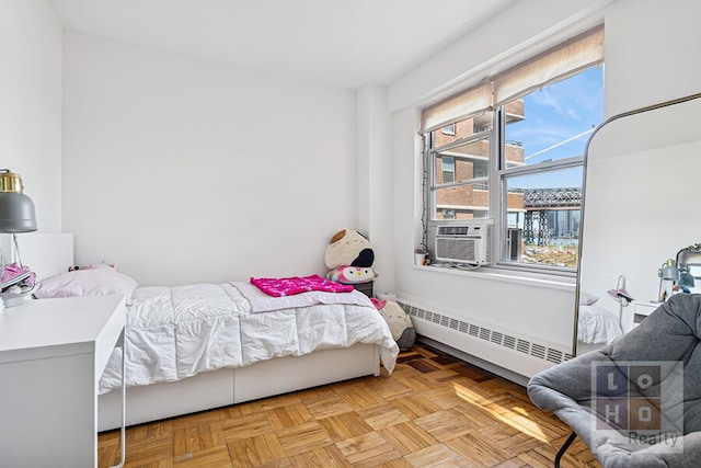 455 Fdr Dr Unit B405, New York City, NY 10002 - bedroom featuring cooling unit, multiple windows, and a baseboard radiator