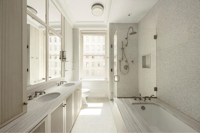 full bath with an enclosed shower, a tub to relax in, toilet, and double vanity