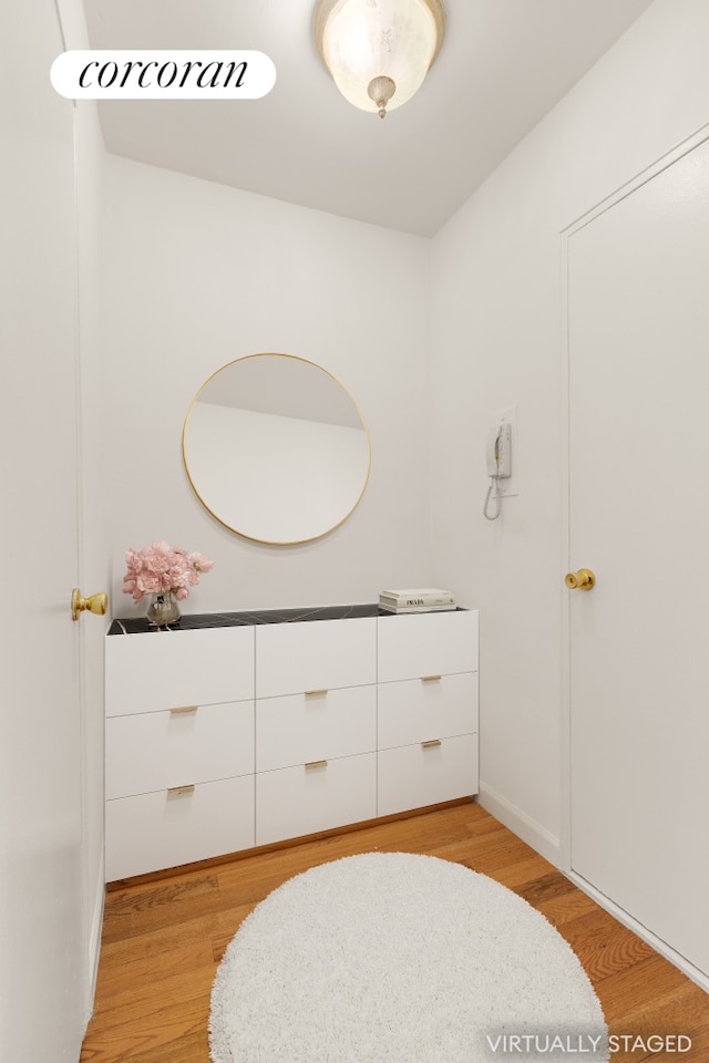 405 E 63rd St Unit 5N, New York City, NY 10065 - bathroom featuring wood finished floors and baseboards