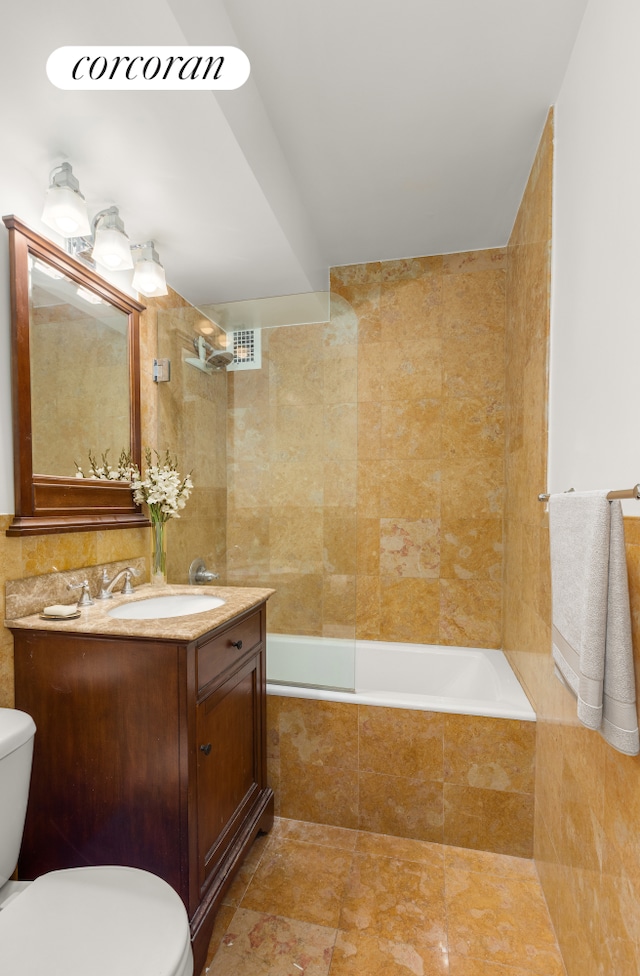 405 E 63rd St Unit 5N, New York City, NY 10065 - bathroom with toilet, tiled shower / bath combo, vanity, and tile patterned floors