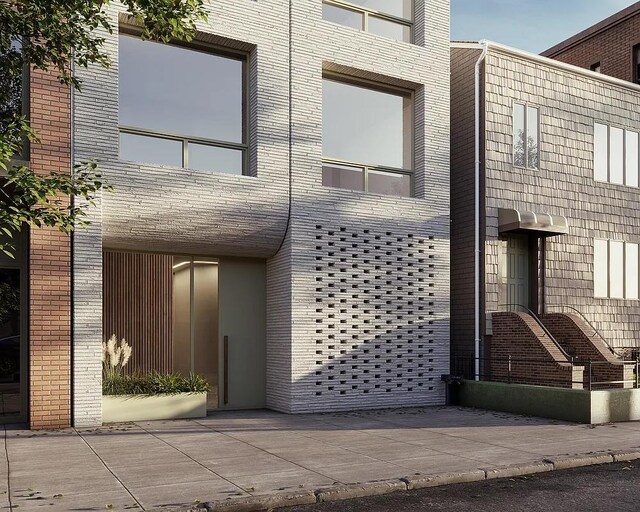 view of front of property featuring brick siding