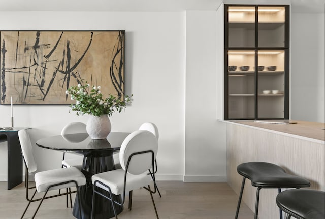 dining room with wood finished floors and baseboards