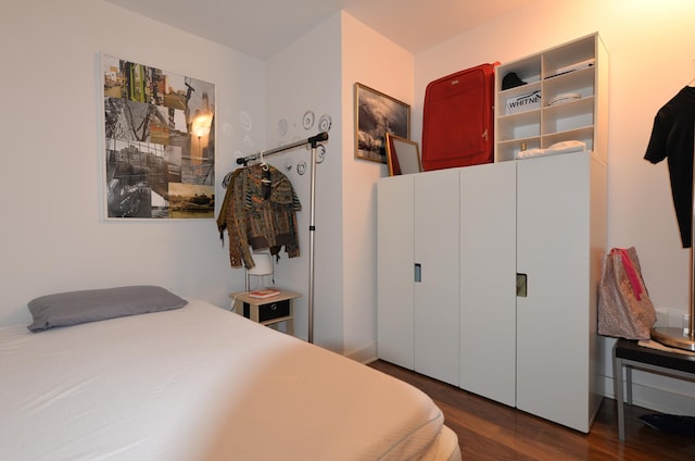 bedroom featuring wood finished floors
