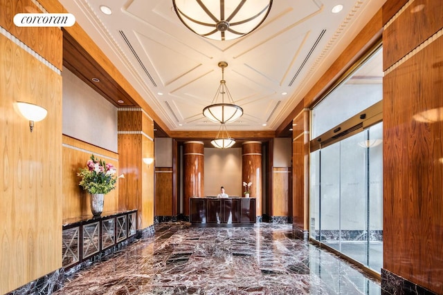 200 Riverside Blvd Unit 19J, New York City, NY 10069 - building lobby featuring coffered ceiling, wood walls, crown molding, and recessed lighting