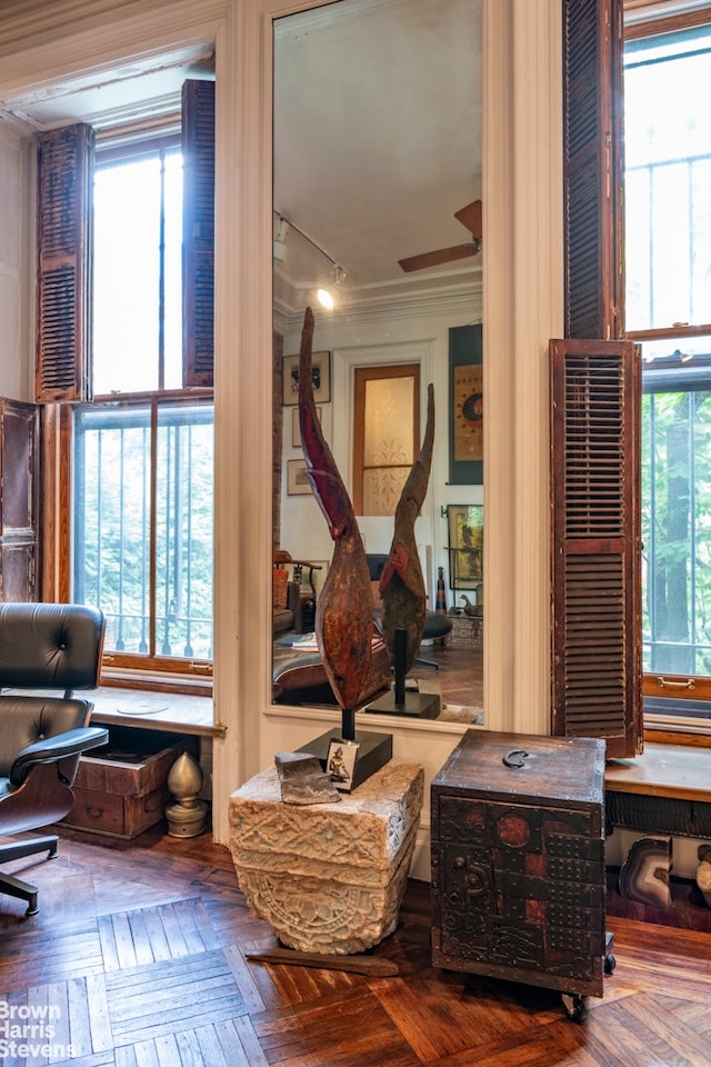 living area with ornamental molding