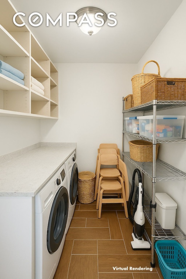 washroom with washer and clothes dryer and wood finished floors