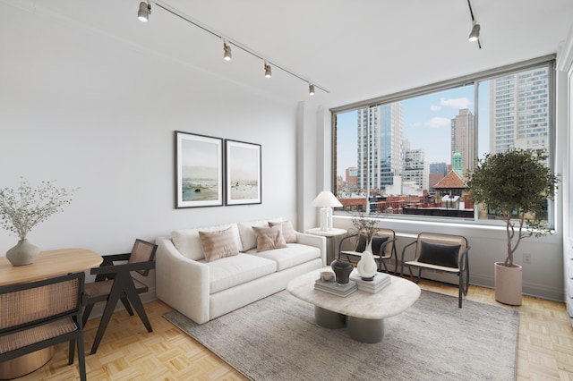 350 E 82nd St Unit 7-G, New York City, NY 10028 - living area featuring rail lighting and a city view