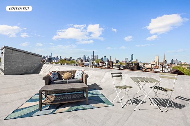 view of patio / terrace with a skyline view and an outdoor hangout area