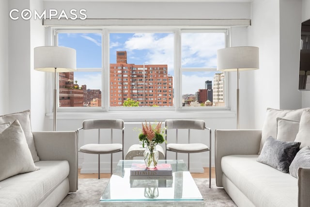 101 W 12th St Unit 12B, New York City, NY 10011 - living room featuring a view of city and wood finished floors