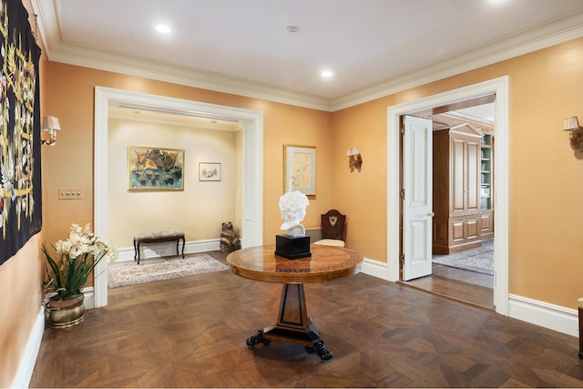 corridor featuring baseboards, ornamental molding, and recessed lighting