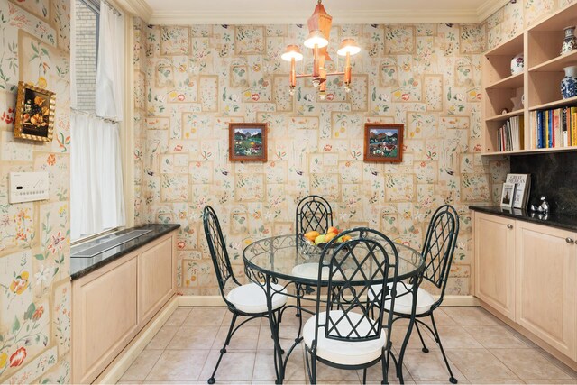 33 E 70th St Unit 7C, New York City, NY 10021 - dining space with crown molding, wallpapered walls, light tile patterned floors, a chandelier, and baseboards