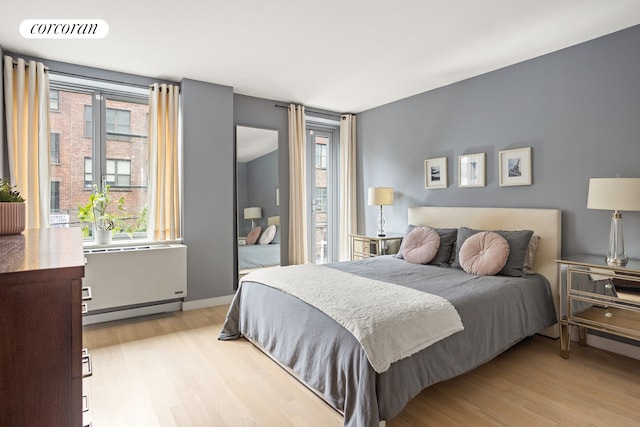 bedroom featuring light wood-style flooring