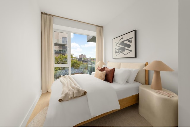 684 Dean St Unit 4, New York City, NY 11238 - bedroom featuring access to exterior and wood finished floors